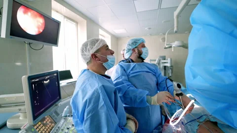 Surgery with microscope. Team of doctors Stock Footage 140501073