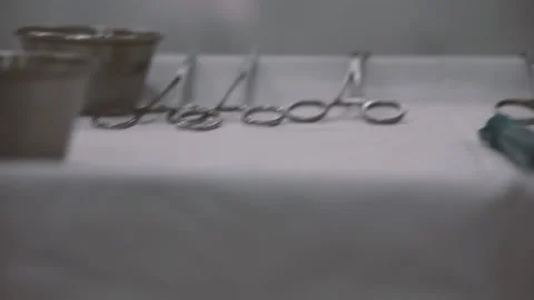 Surgery operation. Close up of surgery hands take off wadding tampon in blood Stock Footage 132099603