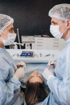 Surgery operation. Group of surgeons in operating room with surgery equipment Stock Photos