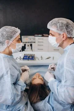 Surgery operation. Group of surgeons in operating room with surgery equipme.. Stock Photos