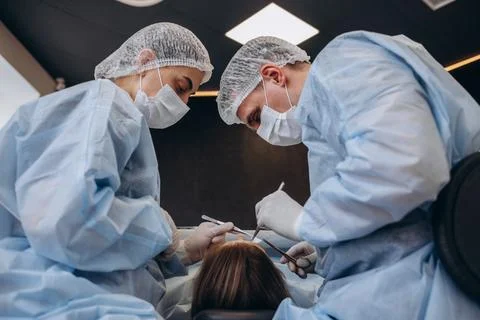 Surgery operation. Group of surgeons in operating room with surgery equipment Stock Photos