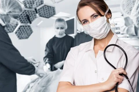 Surgery team operating Stock Photos
