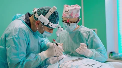 Surgery team in operating room Stock Footage 135605120