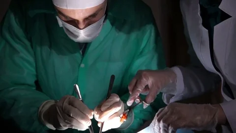 Surgery team operating in a surgical room. Stock Footage 72285988
