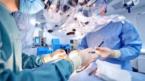 Surgery team operating in a surgical room. Closeupof the process. Stock Footage