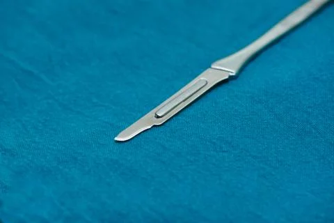 A surgical blade on the table Stock Photos