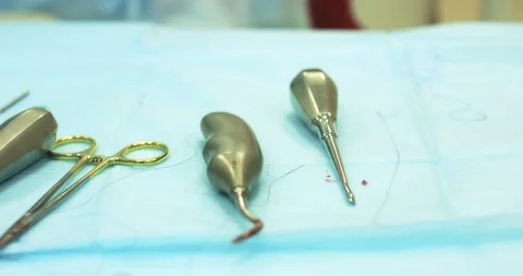 Surgical dental instruments on the table during tooth extraction surgery Stock Footage 166203381