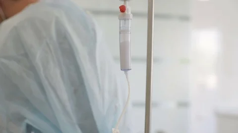 Surgical dripper closeup on the background of the surgeons Stock Footage 79620455