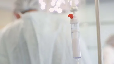 Surgical dripper closeup on the background of the surgeons Stock Footage 79620483