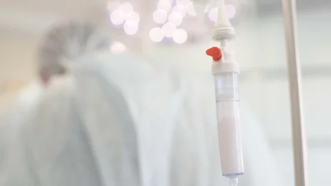 Surgical dripper closeup on the background of the surgeons Stock Footage 79620506