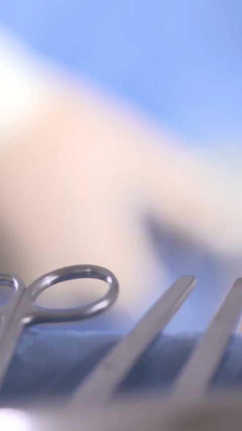 Surgical Hands With Instruments In Foreground. Vertical Format Stock Footage 328667903
