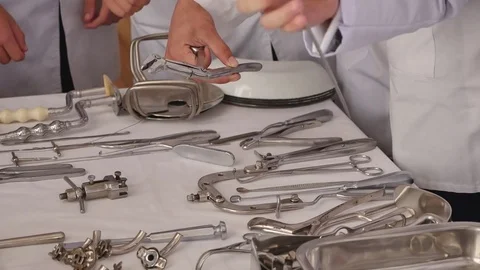 Surgical instruments and tools with hands Stock Footage 72595351