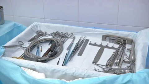 Surgical instruments and tools including scalpels, forceps and tweezers arranged Video stock 83203490