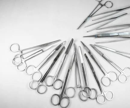  surgical instruments arranged in a pattern 3 surgical Scissors arranged i... Stock Photos