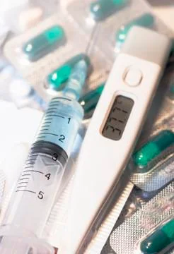 Surgical instruments, digital thermometer, vial of medicine, 3 ml plastic syr Stock Photos