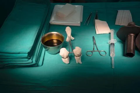 Surgical instruments on green table Stock Photos