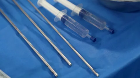 Surgical instruments for liposuction on the sterile table of an operating Stock Footage 254103857