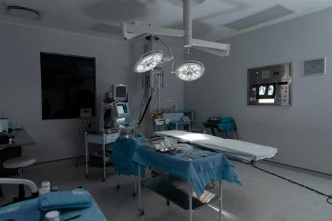 Surgical instruments, operating table, lights and equipment in modern hospital Stock Photos