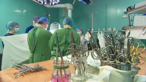 Surgical instruments on the table. surgeons near the operating table Video stock 95940860