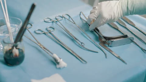 Surgical instruments on a tray in an operating room Stock Footage 280112152