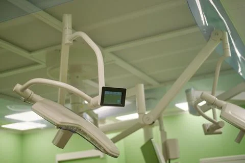 Surgical lights over operating table. Modern operating room equipment with br Stock Photos