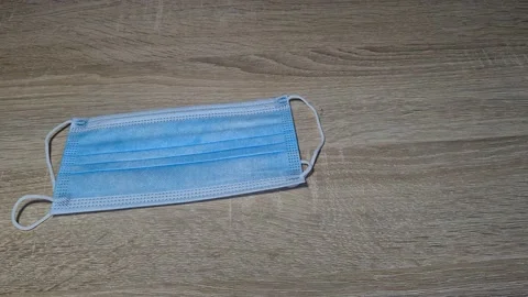 Surgical Mask Dropping On Table Stock Footage 151899687
