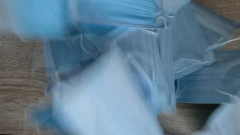 Surgical Masks Dropping On Table Video stock 156104295