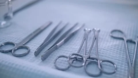 Surgical medical instruments on the table Stock Footage 150885367