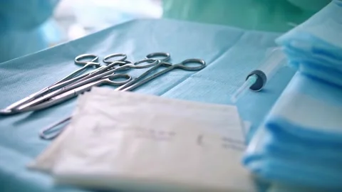 Surgical medical instruments on the table Stock Footage 150886006