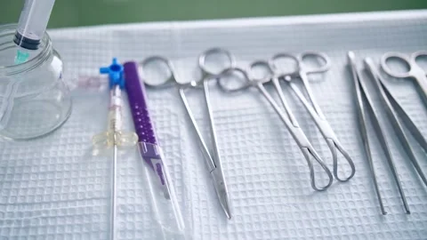 Surgical medical instruments on the table Stock Footage 150888209