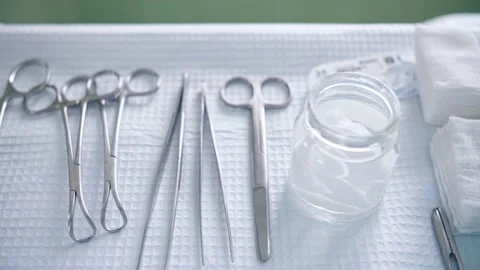 Surgical medical instruments on the table Stock Footage 150888742