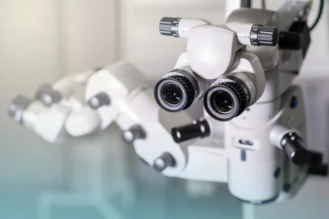 Surgical microscope in operating room with doctors. Ophthalmological clinic. Foto stock