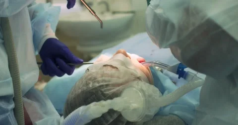 Surgical operation to remove a tooth under anesthesia Stock Footage 166203333