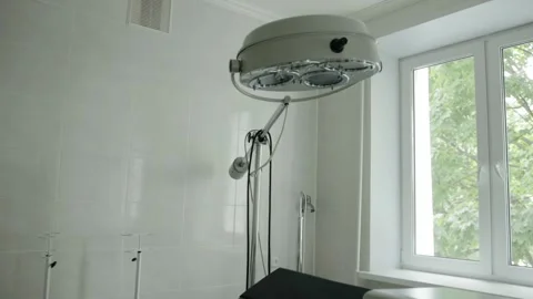 Surgical room in a clinic, interior. Couch and electrocoagulator in the room Video stock 320603693