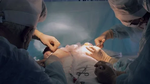 Surgical team completing operation Stock-Footage 68930666