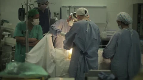 Surgical Team Doing Open Heart Surgery In An Operating Room Stock Footage 217430174
