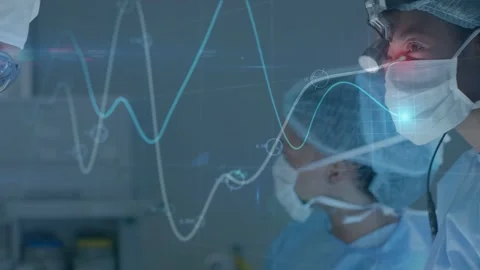 Surgical team operating while camera panning rightward guiding medical Stock Footage 333817718