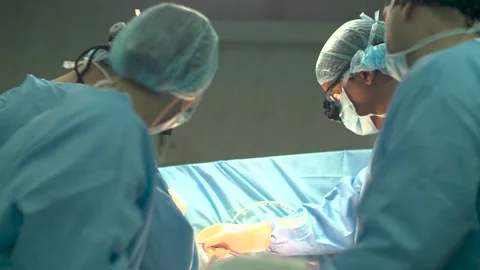 Surgical Team Performing Operation in Operating Room Stock Footage 309759912