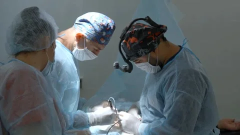 Surgical Team Performing Procedure in Hospital Operating Room Stock Footage 314303653