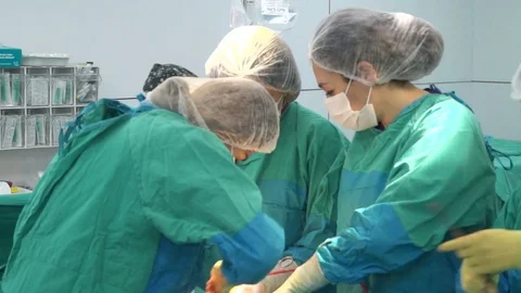 Surgical team performing surgery operation, cesarean section. Stock-Footage 72680910