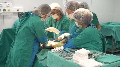 Surgical team performing surgery operation, cesarean section. Stock-Footage 72682476