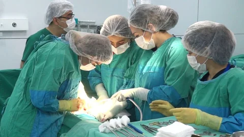 Surgical team performing surgery operation, cesarean section. Video stock 72682500