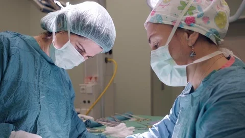 Surgical Team Performing Surgery Operation, Cesarean Section Stock Footage 119110997
