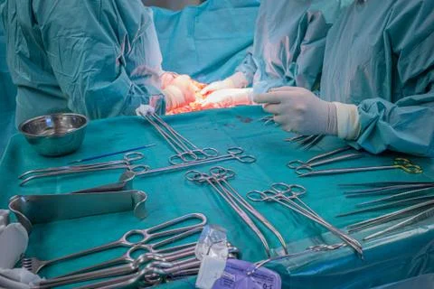 A surgical team performs a surgical abdominal operation Stock Photos