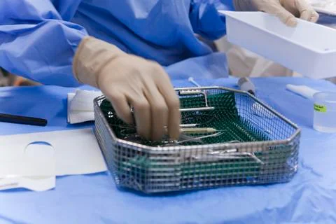 Surgical technologist cleaning the back table Stock Photos