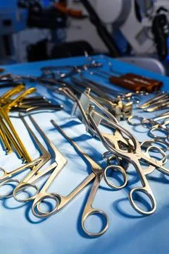Surgical tools and scissors on blue medical tray for operation Stock Photos