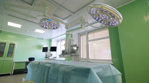 Surgical unit with a bed and functioning lamps Video stock 107203140