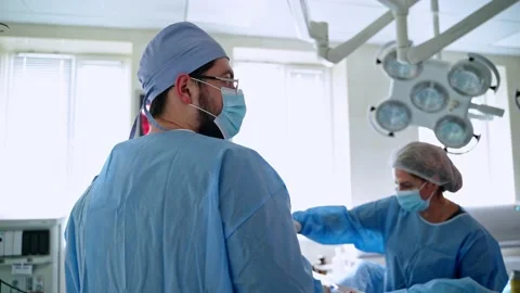 Surgical work in the operating theater. Team of doctors Stock Footage 135886509