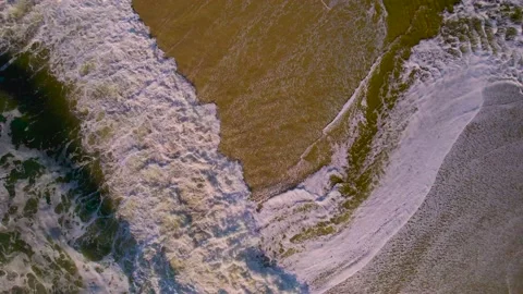 Surging surf on empty beach Video stock 237483052