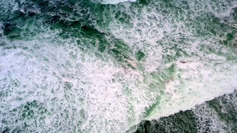 Surging Waves Dance With Light in a Mesmerizing Coastal Display at Sunset Stock Footage 344745086